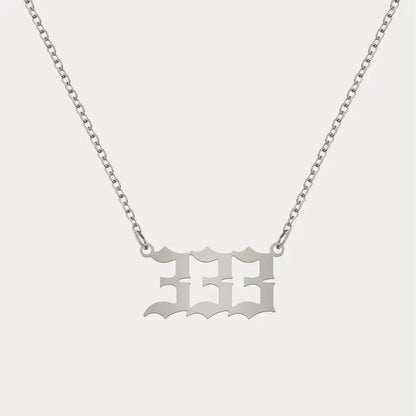 Angel Number Pendant Necklace by AUREATE featuring a 333 design on a silver chain.