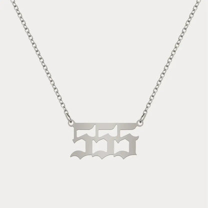 Angel Number Pendant Necklace by AUREATE, featuring a minimalist silver design for daily spiritual wear.