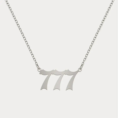 Angel Number Pendant Necklace by AUREATE featuring a sleek silver design with the number 777, perfect for daily wear.
