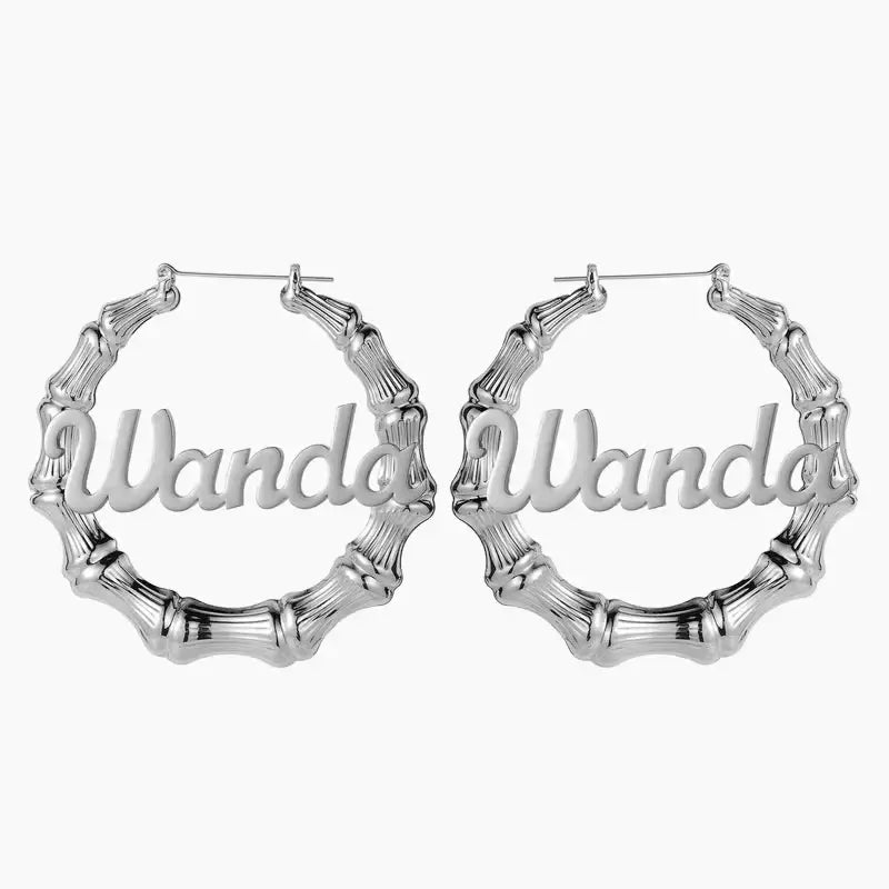 Name Bamboo Hoop Earrings by AUREATE in silver featuring personalized name design.