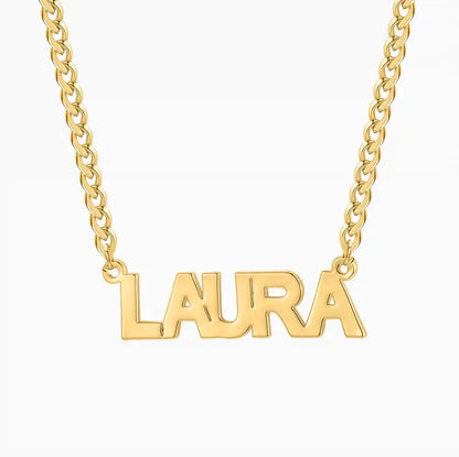 Block Name Necklace with Cuban Chain personalized with the name 'LAURA' in bold gold lettering by AUREATE.
