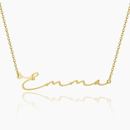 Aureate Petit Name Necklace in gold with personalized name 'Emma', sleek and elegant design for minimalist style.