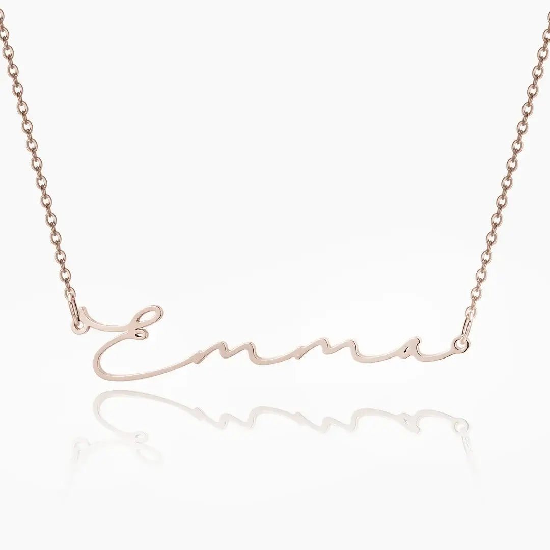AUREATE Petit Name Necklace personalized with the name Emma in elegant gold design.