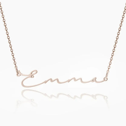 AUREATE Petit Name Necklace personalized with the name Emma in elegant gold design.