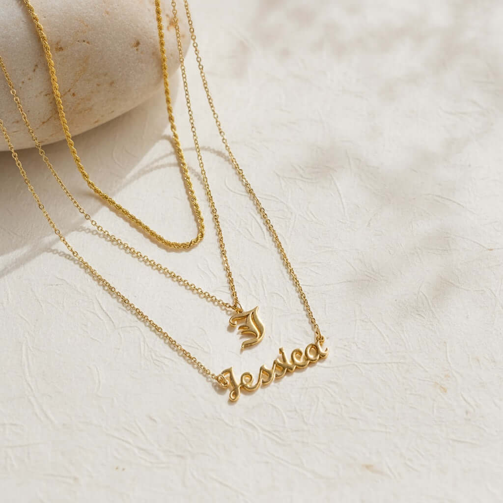 Personalised Name Necklace by AUREATE featuring a gold plated design with the name Jessica and elegant layered chains.