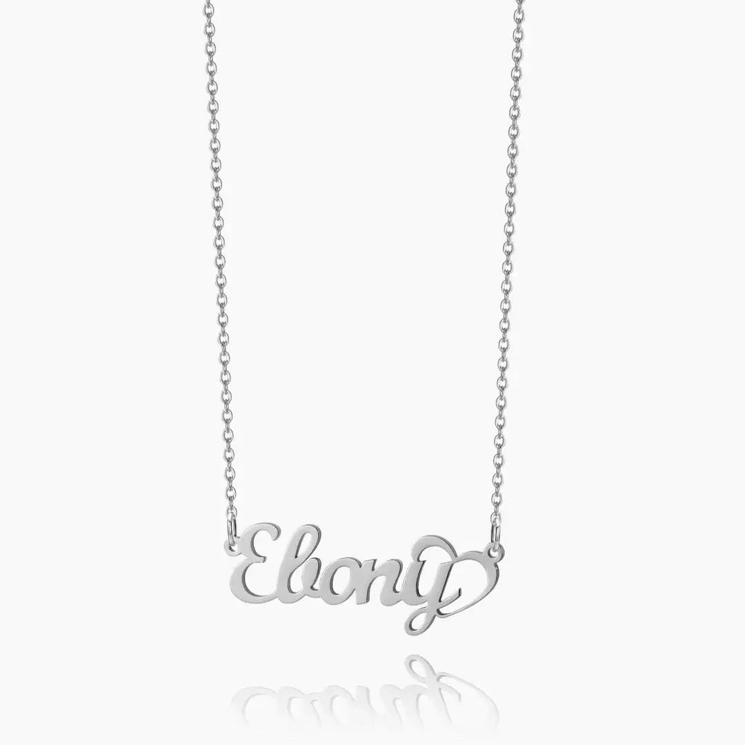 Crescent Heart Personalised Name Necklace by AUREATE featuring a silver name pendant that says 'Ebony'.