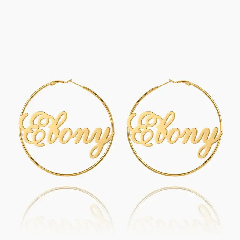 Script Name Hoop Earrings by AUREATE in gold with cursive lettering design, perfect for personalization.