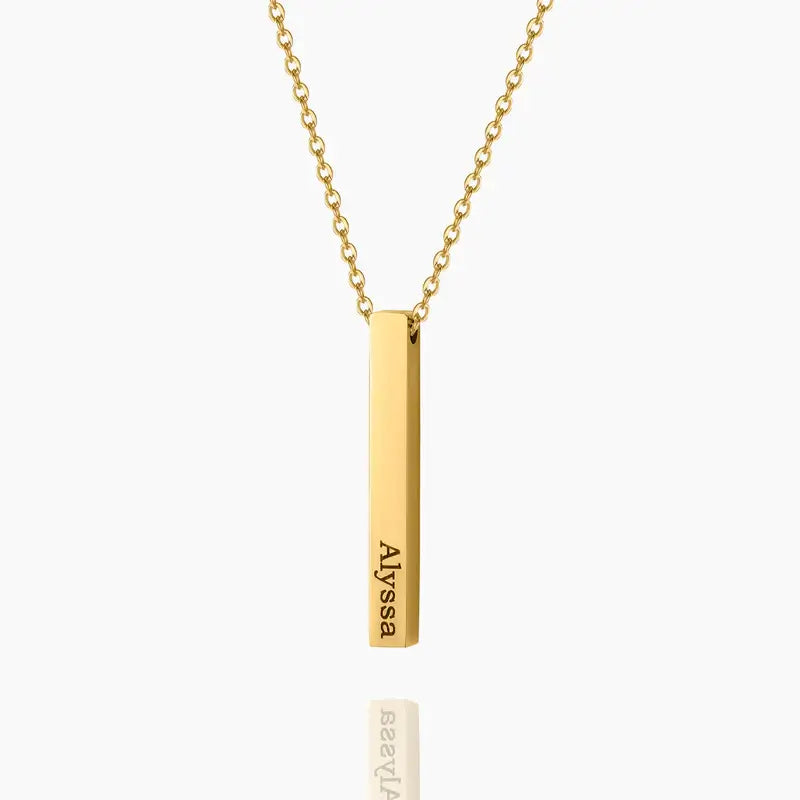 3D Bar Engraved Necklace by AUREATE featuring a gold bar pendant with the name Alyssa