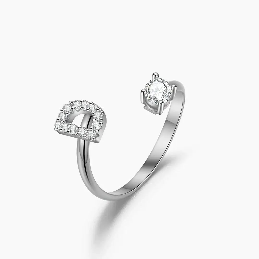 Iced Initial Signet Ring by AUREATE featuring a silver band with sparkling diamond accents.