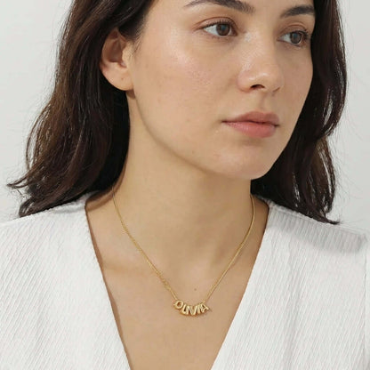 Bubble Style Name Necklace by AUREATE showcased on model, capturing the playful and polished design of 2026 trends.