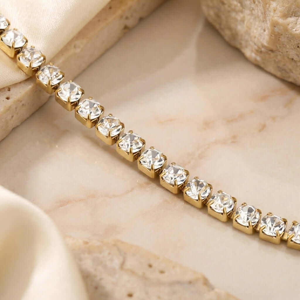 Classic Tennis Bracelet by AUREATE, featuring a luxurious line of sparkling crystals set in gold.