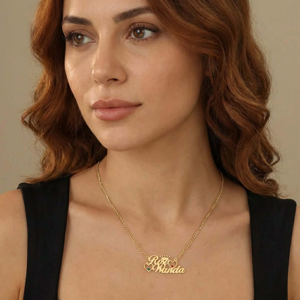 Double Heart Name Necklace with Cuban Chain by AUREATE worn by a woman, showcasing personalized names in gold.