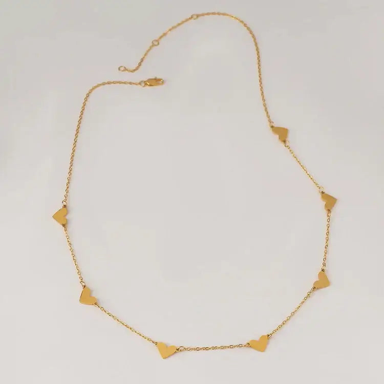 Double Heart Necklace by AUREATE featuring a delicate design with intertwined heart motifs.