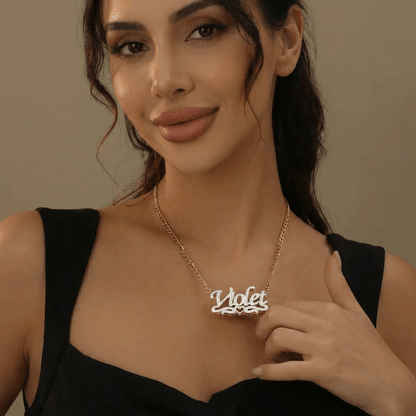 Double Plated Heart Title Name Necklace with Figaro Chain worn by a model showcasing the name 'Violet' in a stylish design.