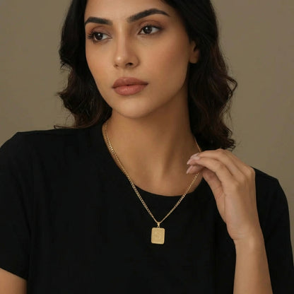 Embossed Initial Necklace with Cuban Chain model wearing AUREATE brand jewelry, showcasing its textured design.