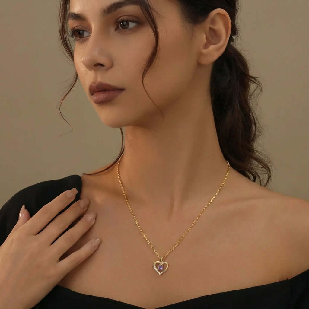 AUREATE Heart Birthstone Necklace worn by a model, showcasing a heart-shaped pendant with a vibrant gemstone.