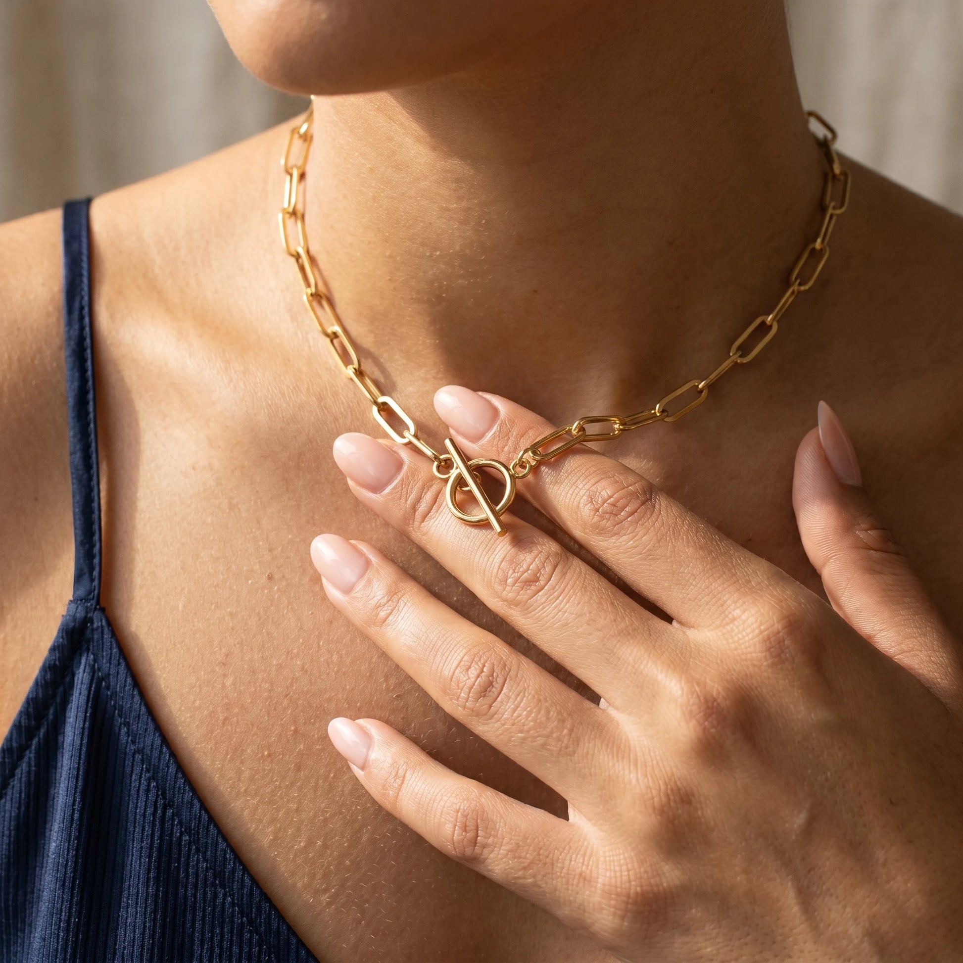 Paperclip toggle necklace gold intimate fingertips touching toggle clasp