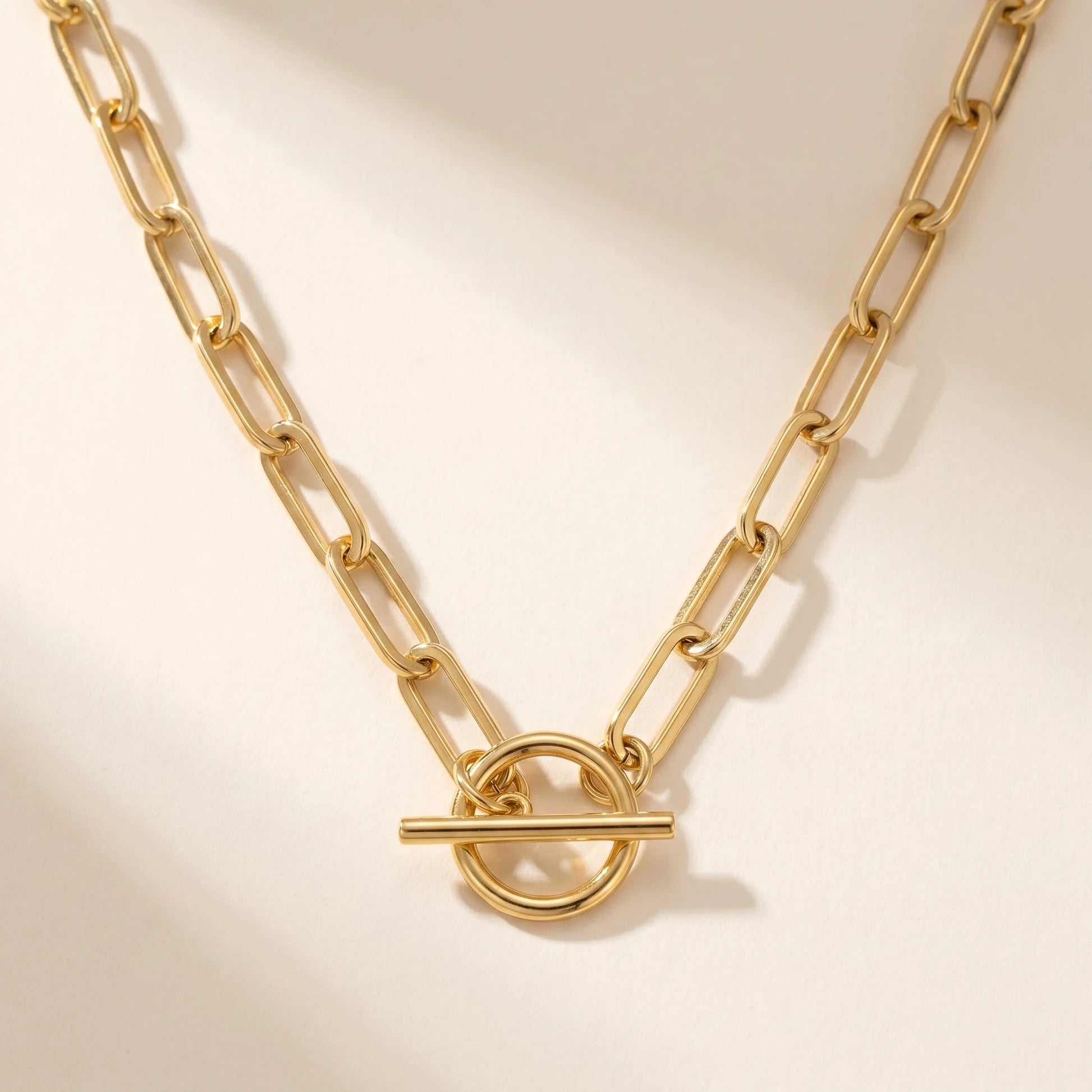 Paperclip toggle necklace gold packshot on white background