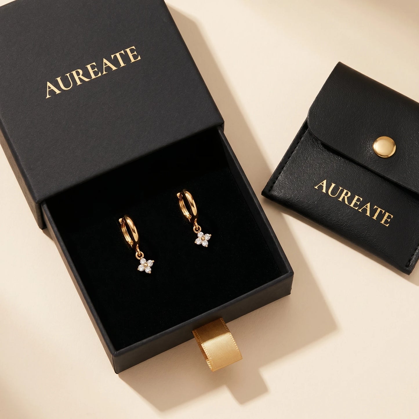 Gold petite clover huggie earrings AUREATE gift box