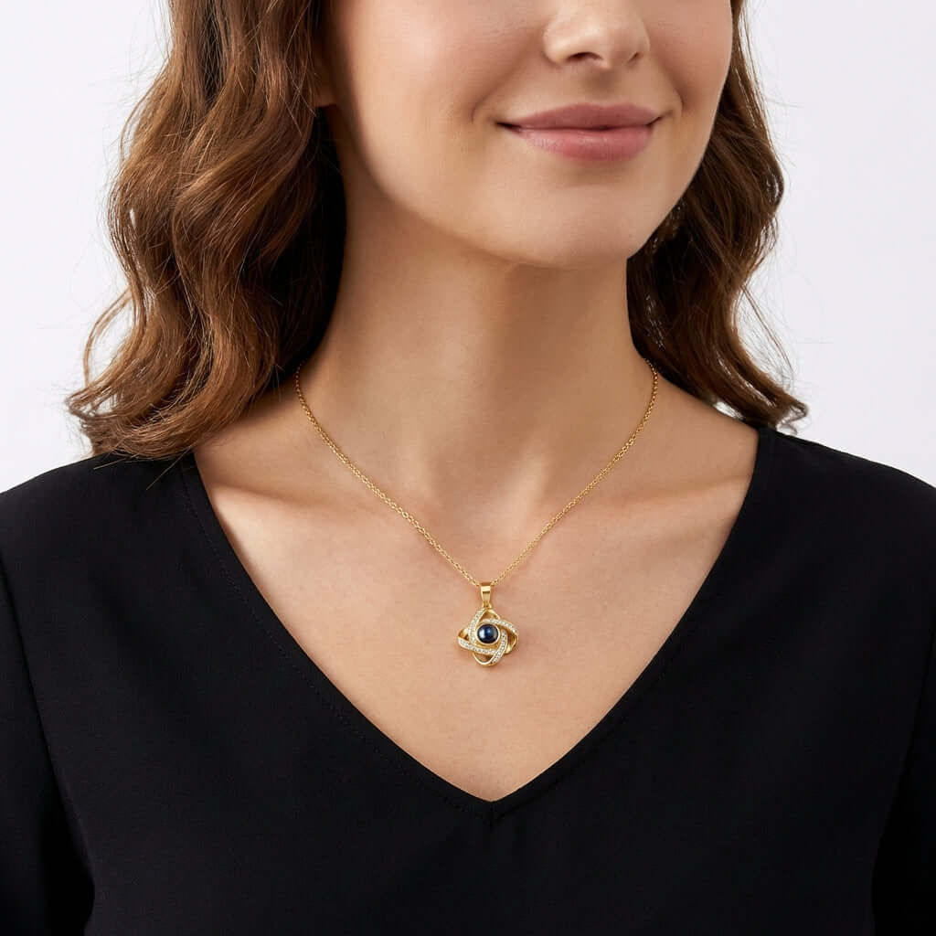 Photo Projection Necklace by AUREATE worn by a woman, showcasing its unique design and craftsmanship.