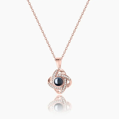 Photo Projection Necklace by AUREATE, featuring a rose gold design and a unique interactive element.