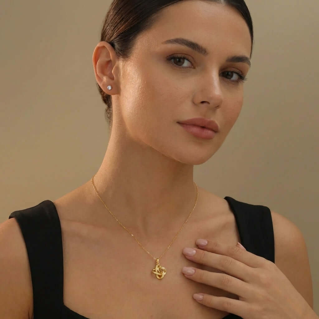 Aureate Photo Projection Necklace worn by a woman, showcasing its elegant design and interactive features.