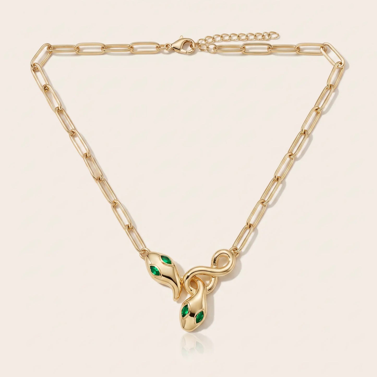 Snake Pendant Necklace AUREATE gold 18K paperclip chain packshot - entwined serpent clasp emerald eyes