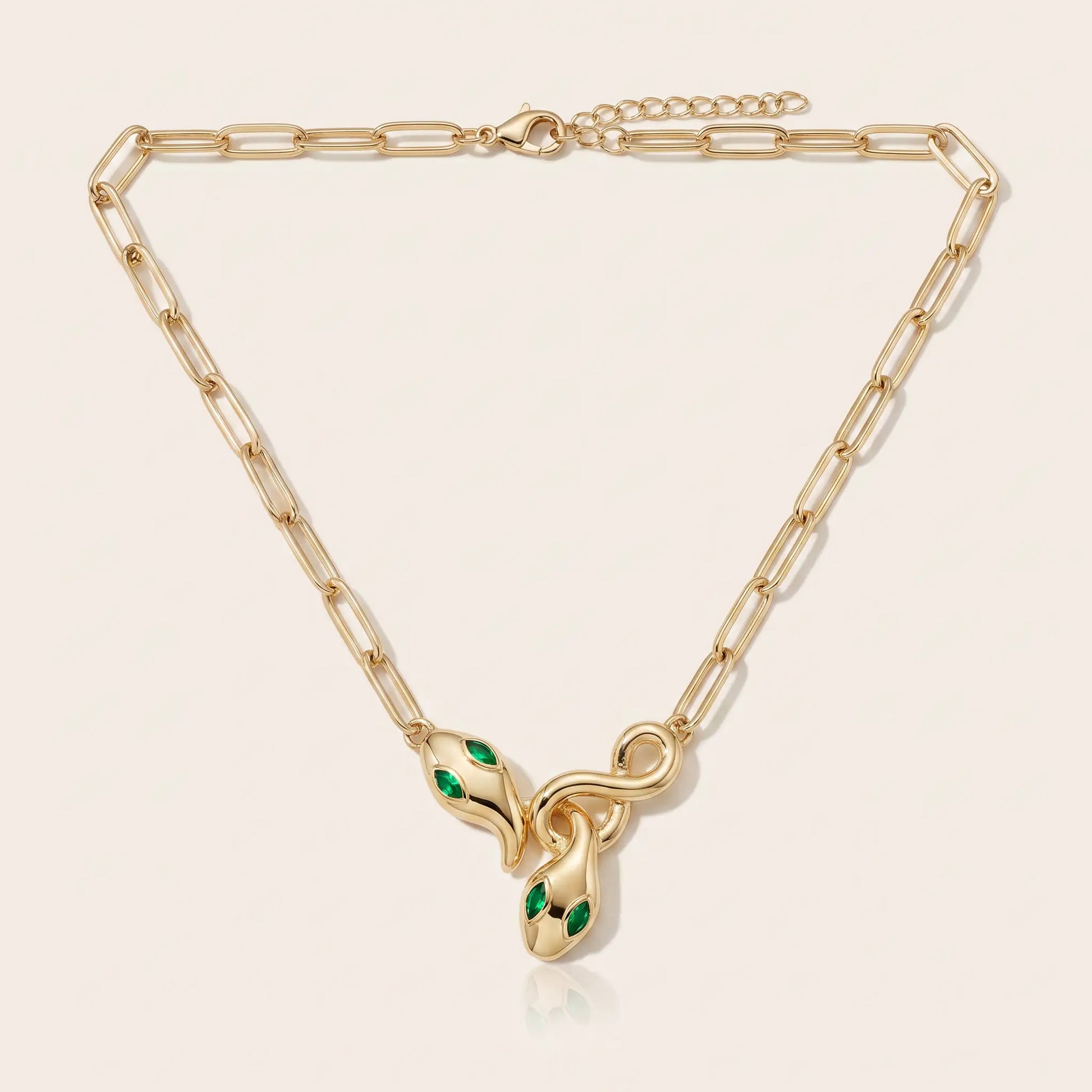 Snake Pendant Necklace AUREATE gold 18K paperclip chain packshot - entwined serpent clasp emerald eyes
