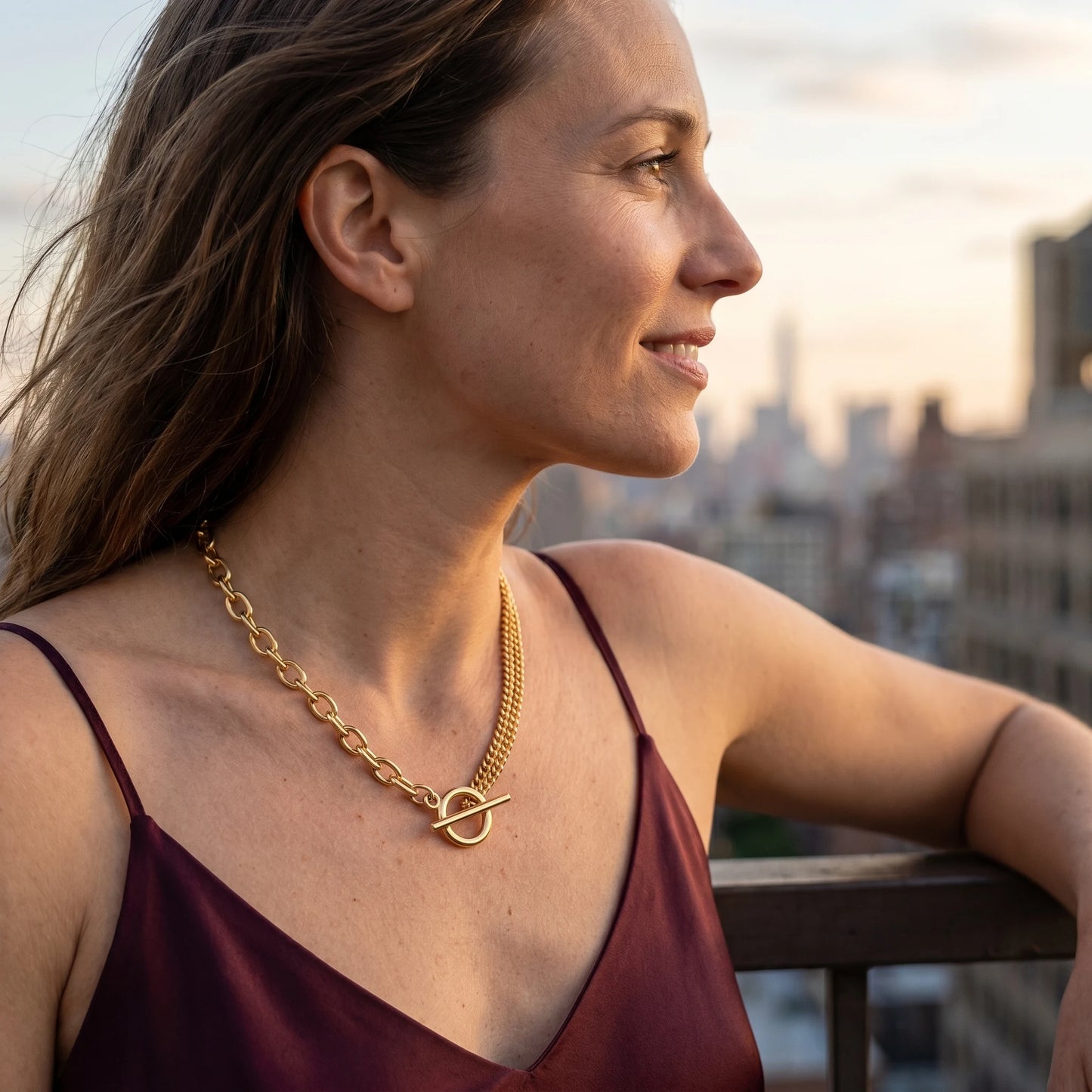 Toggle Cable Curb Necklace gold profile portrait at golden hour rooftop