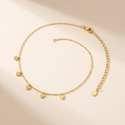 Tiny gold heart drop anklet packshot dainty wire-thin chain with five hearts