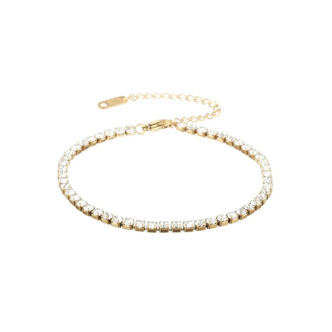 Aureate Classic Tennis Bracelet featuring a gold chain with sparkling clear gemstones, ideal for a timeless luxury look.