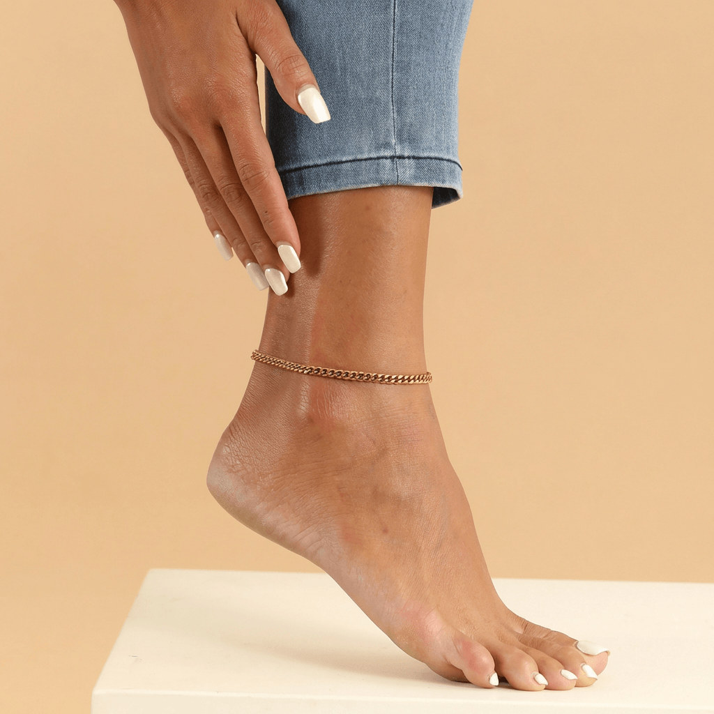Cuban Link Chain Anklet by AUREATE showcased on a model's ankle, perfect for Coastal Luxe summer styling.