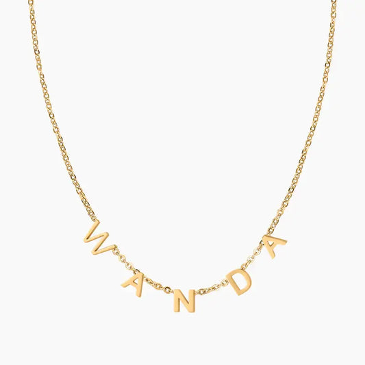 Personalised Letter Necklace by AUREATE featuring gold letters spelling 'WANDA' on a delicate chain.
