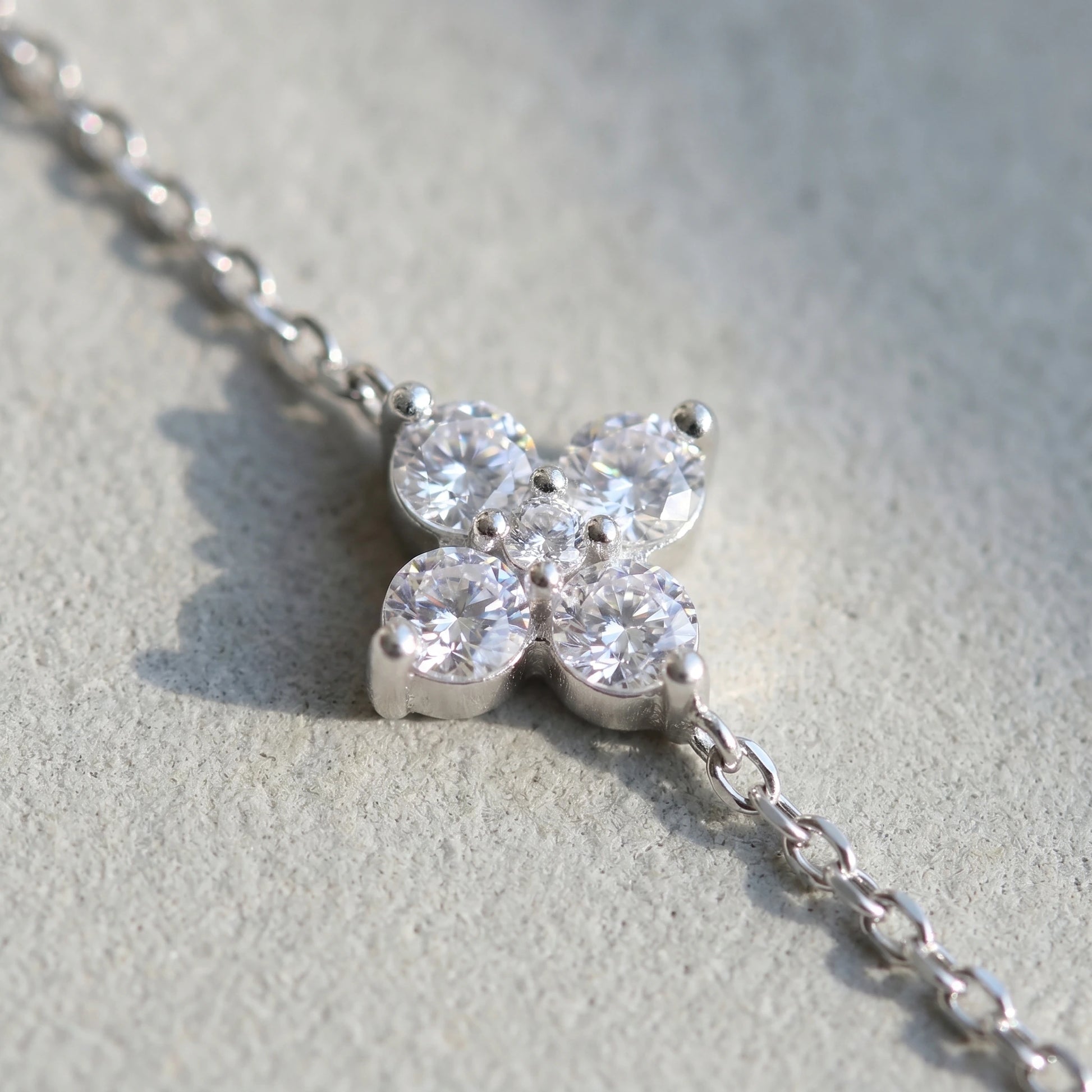 Sterling silver clover bracelet macro pave cz quatrefoil charm detail