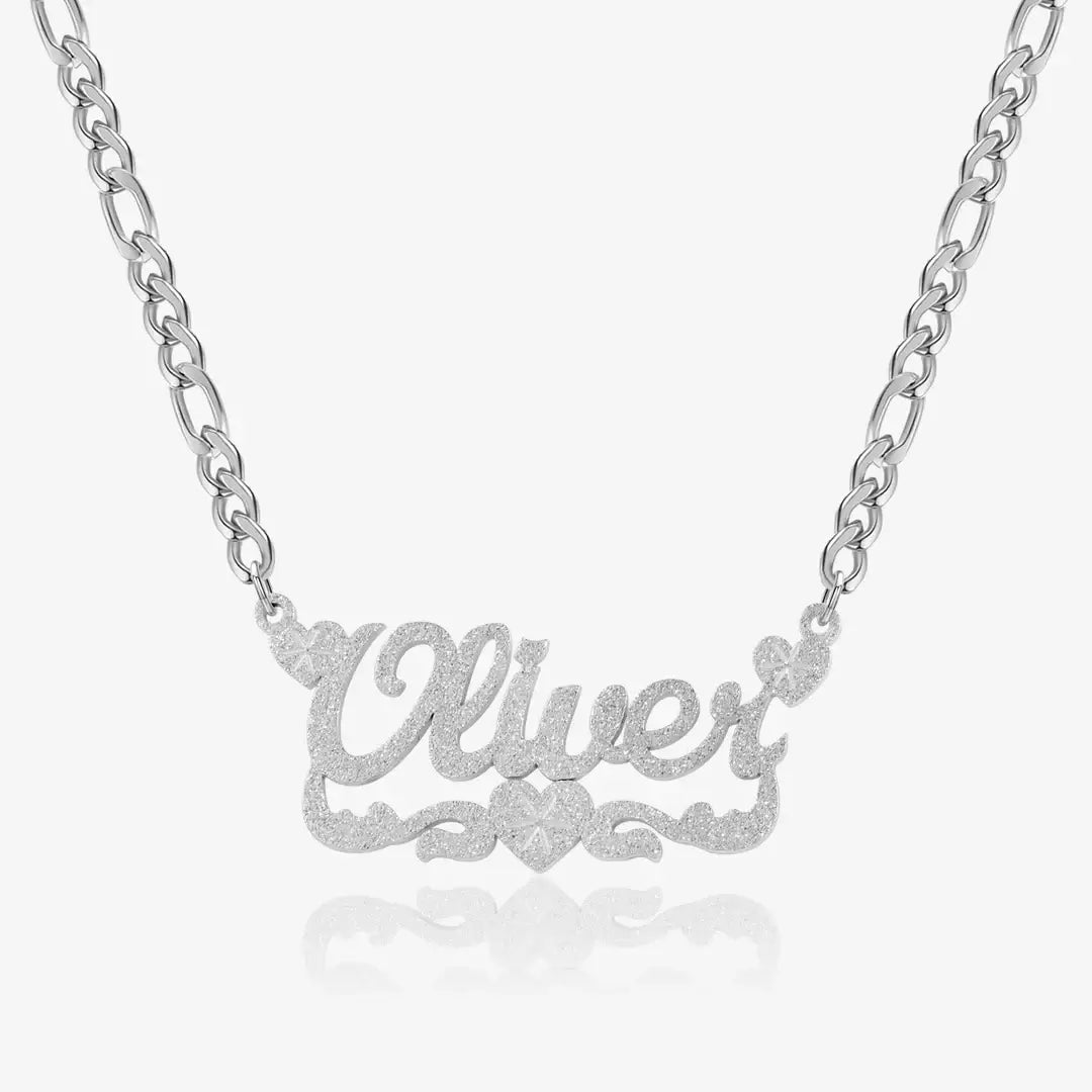 Diamond Cut Heart Name Necklace by AUREATE featuring the name 'Oliver' with sparkling facets.