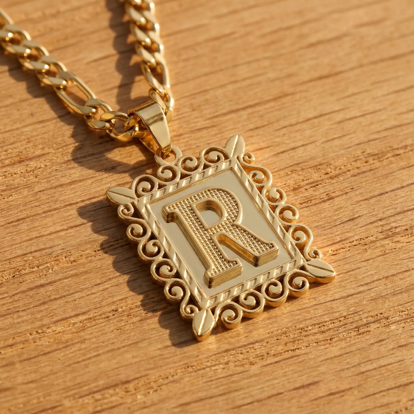 Raised Initial Figaro Pendant 18K gold macro detail R initial