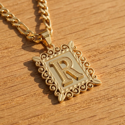 Raised Initial Figaro Pendant 18K gold macro detail R initial