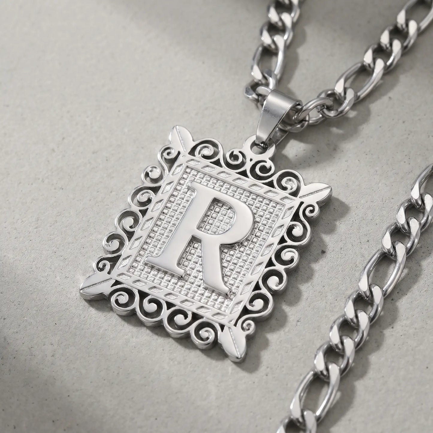 Raised Initial Figaro Pendant silver tone macro detail