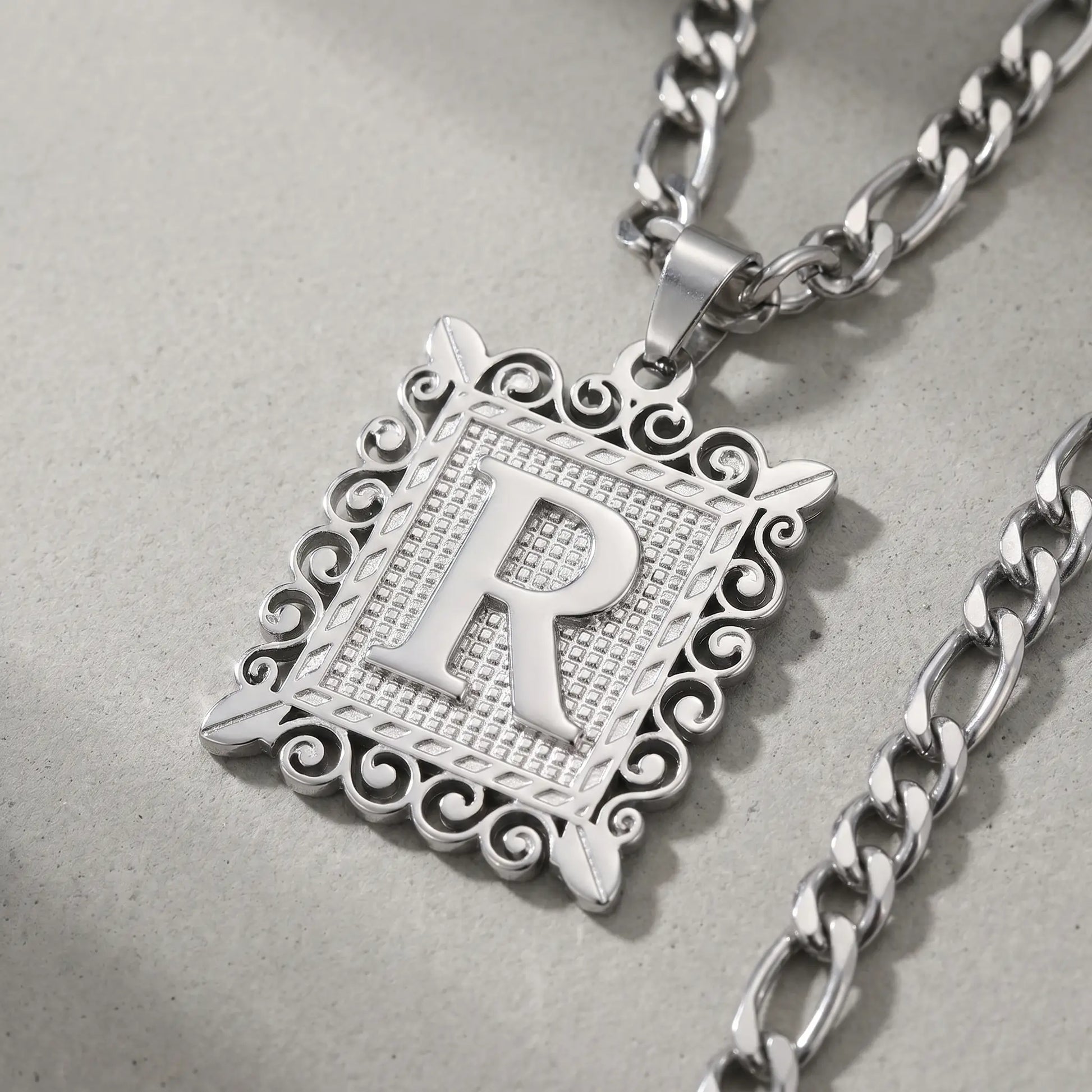 Raised Initial Figaro Pendant silver tone macro detail