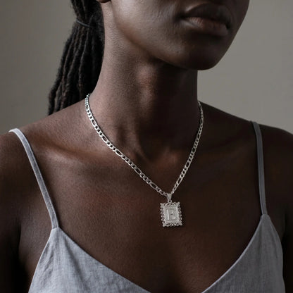 Raised Initial Figaro Pendant silver tone worn close-up