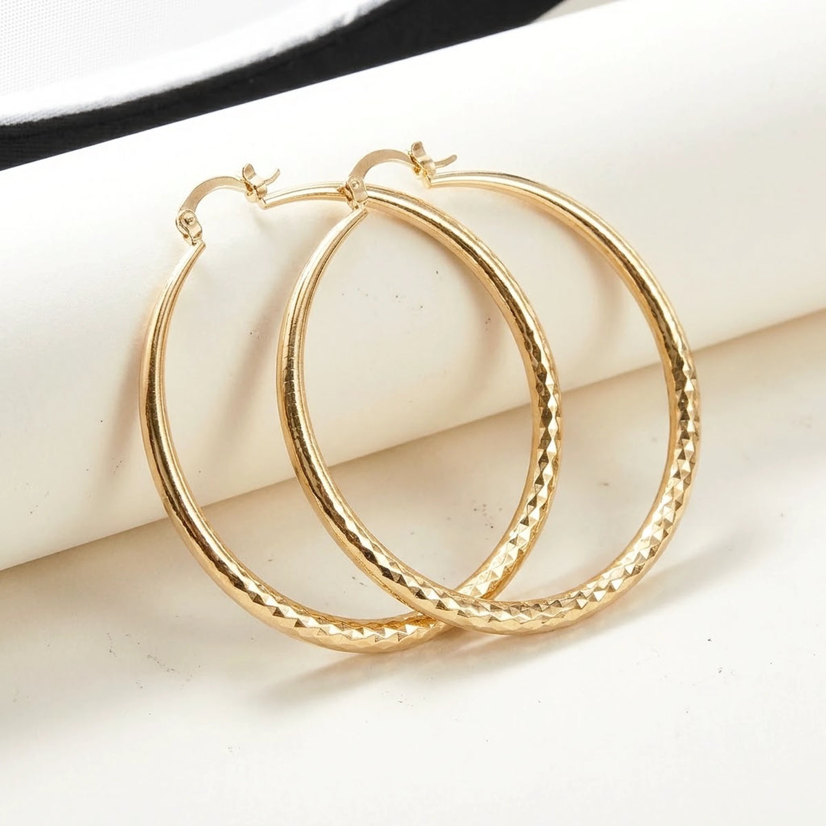 18K gold plated diamond cut large hoop earrings, product shot on white | SKU: AUR-DCTHOP-G