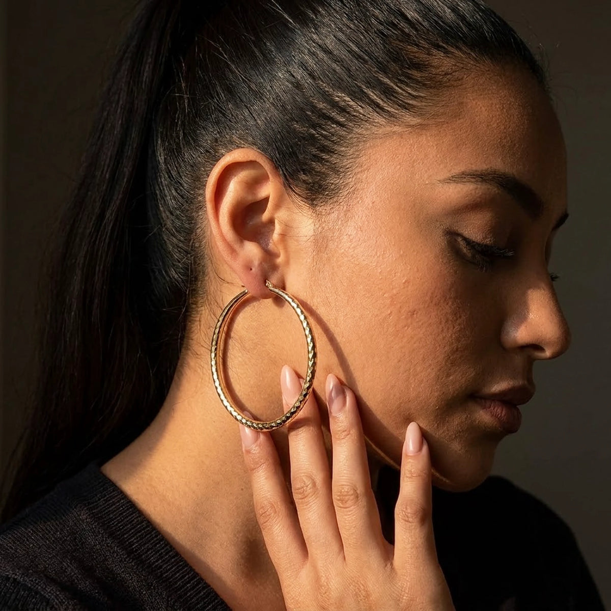 18K gold plated diamond cut large hoop earrings, worn, close detail in warm light | SKU: AUR-DCTHOP-G