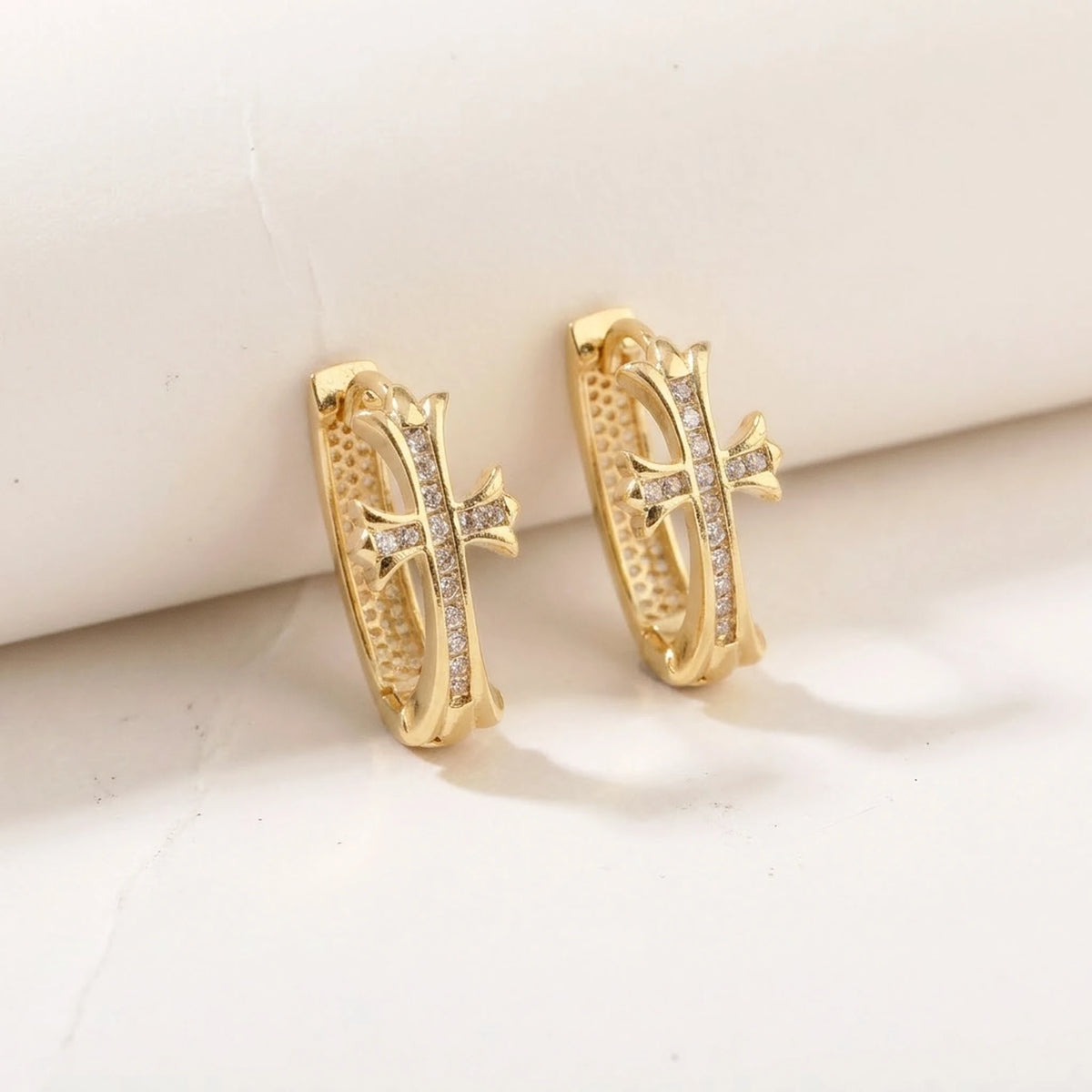18K gold plated pave cross huggie hoop earrings, product shot on white | SKU: AUR-CRXHUG-G
