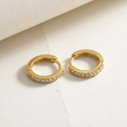 18K gold plated pave huggie hoop earrings, product shot on white | SKU: AUR-PVHUGG-G