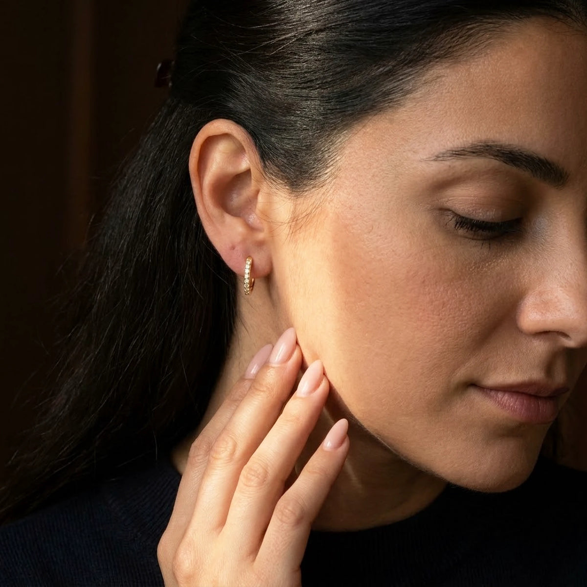 18K gold plated pave huggie hoop earrings, worn, close detail in warm light | SKU: AUR-PVHUGG-G