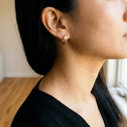 18K gold plated pear cut crystal huggie hoop earrings, worn, three quarter view | SKU: AUR-PRCZHG-G