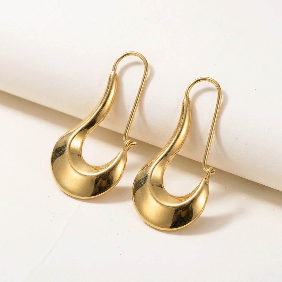 18K gold plated sculpted crescent drop earrings, product shot on white | SKU: AUR-SCPCRS-G
