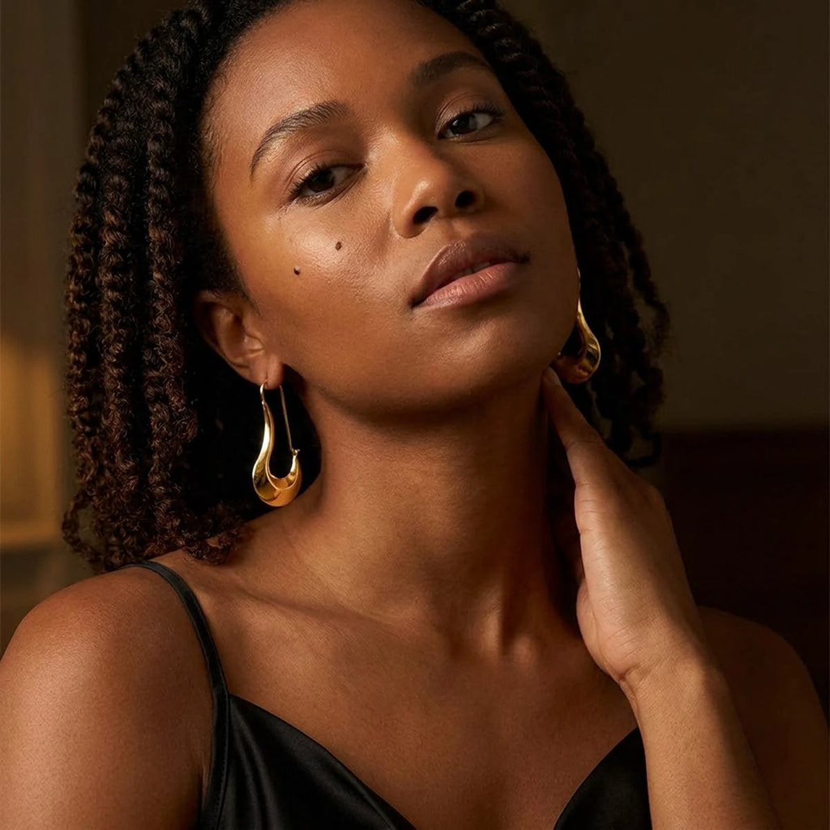 18K gold plated sculpted crescent drop earrings, worn, close portrait | SKU: AUR-SCPCRS-G