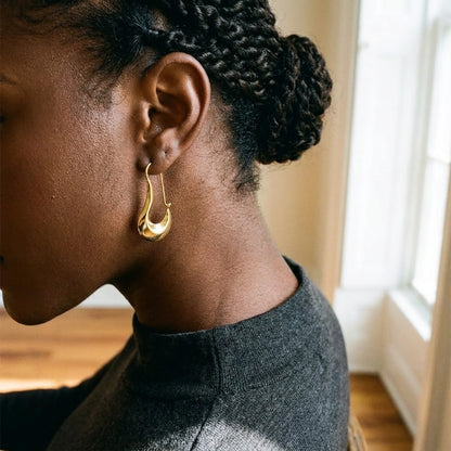 18K gold plated sculpted crescent drop earrings, worn, three quarter view | SKU: AUR-SCPCRS-G
