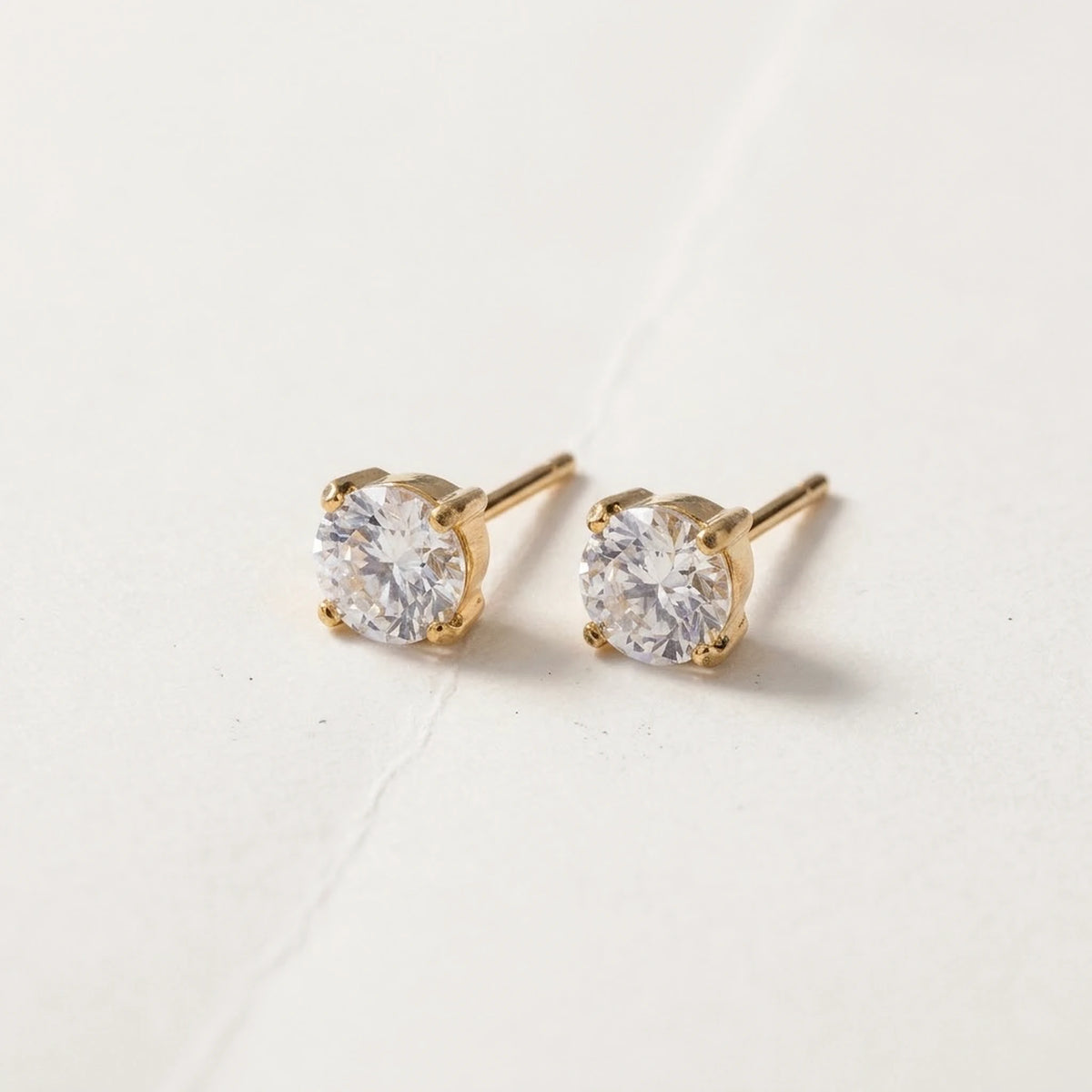 18K gold plated cubic zirconia solitaire stud earrings, product shot on white | SKU: AUR-SOLSTD-G